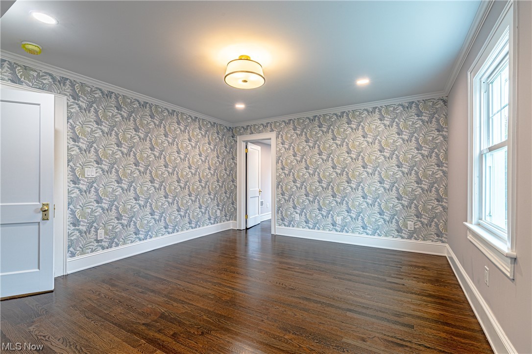 2923 Huntington Road Cleveland, OH 44120 - Photo 23 of 35 Empty room with dark hardwood / wood-style flooring and ornamental molding