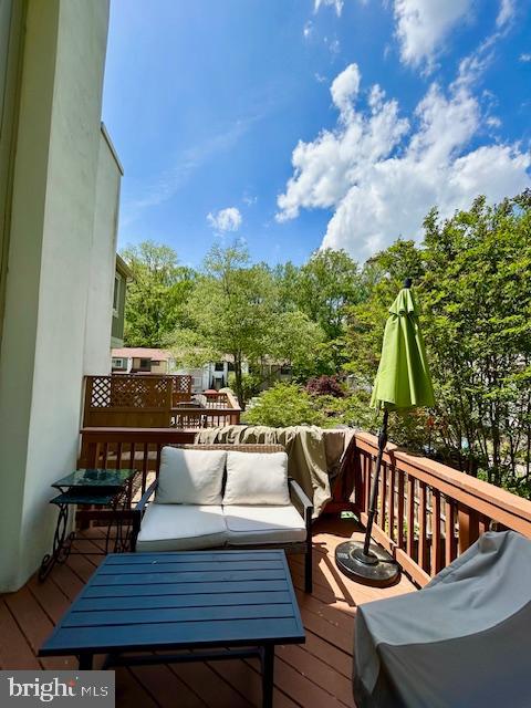 2351 Generation Drive Reston, VA 20191 - Photo 17 of 45 a view of table and chairs with wooden floor and fence