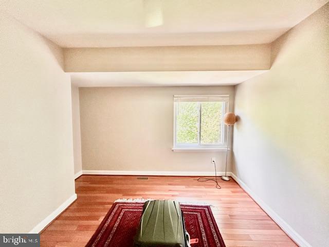 2351 Generation Drive Reston, VA 20191 - Photo 21 of 45 a bedroom with a bed and wooden floor