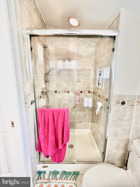2351 Generation Drive Reston, VA 20191 - Photo 29 of 45 a white bath tub sitting next to a shower