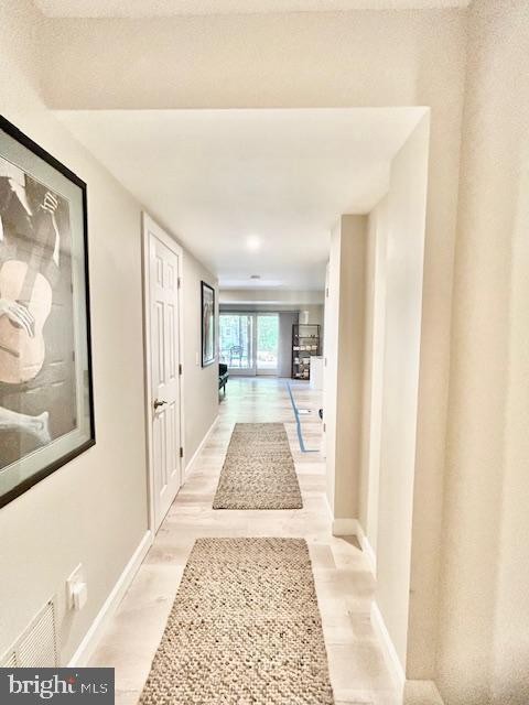 2351 Generation Drive Reston, VA 20191 - Photo 33 of 45 a view of a hallway with wooden floor and cabinet