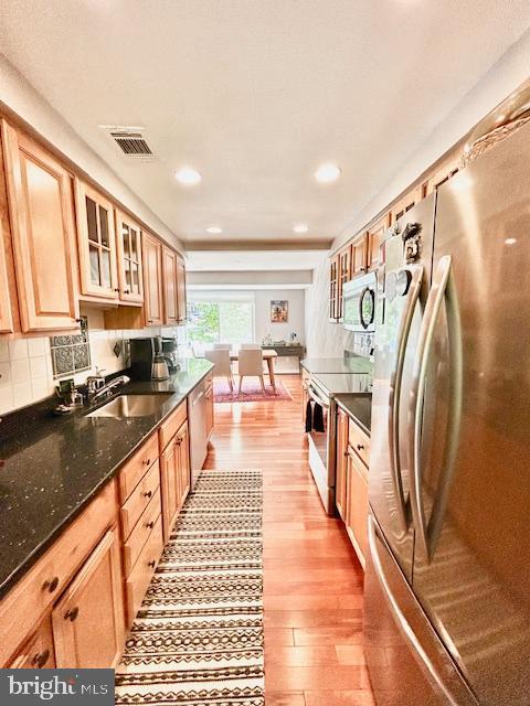 2351 Generation Drive Reston, VA 20191 - Photo 8 of 45 a large kitchen with stainless steel appliances granite countertop a lot of cabinets a sink and a counter top space