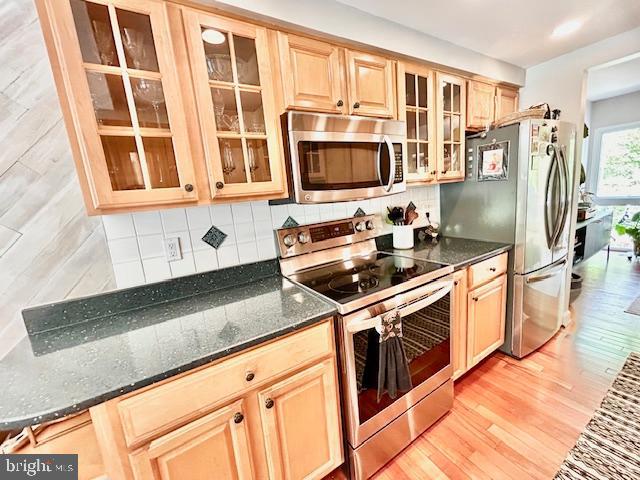 2351 Generation Drive Reston, VA 20191 - Photo 10 of 45 a kitchen with stainless steel appliances granite countertop a stove and a sink