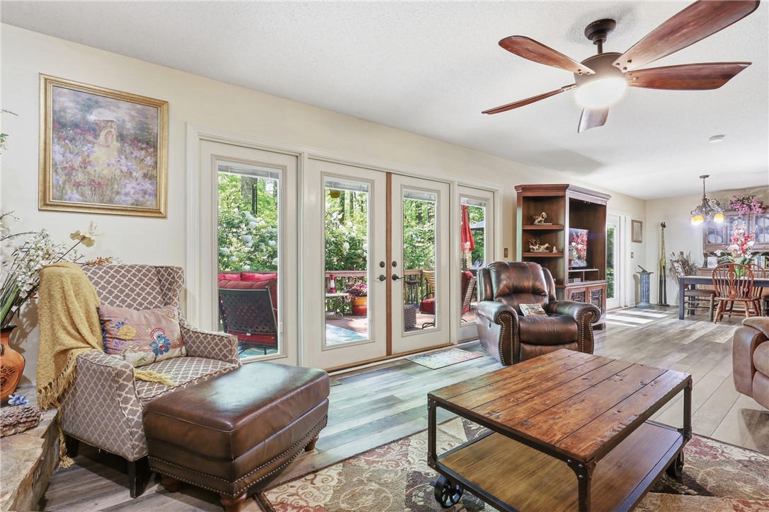 110 Shaftsbury Road Clemson, SC 29631 - Photo 5 of 38 This inviting living space features expansive glass doors leading to an outdoor deck.