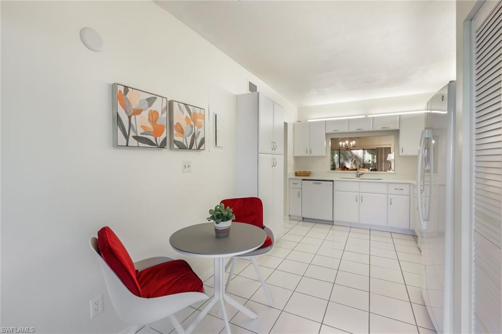 1814 Kings Lake Boulevard, Unit 102 Naples, FL 34112 - Photo 13 of 21 Kitchen with plenty of room for a breakfast table