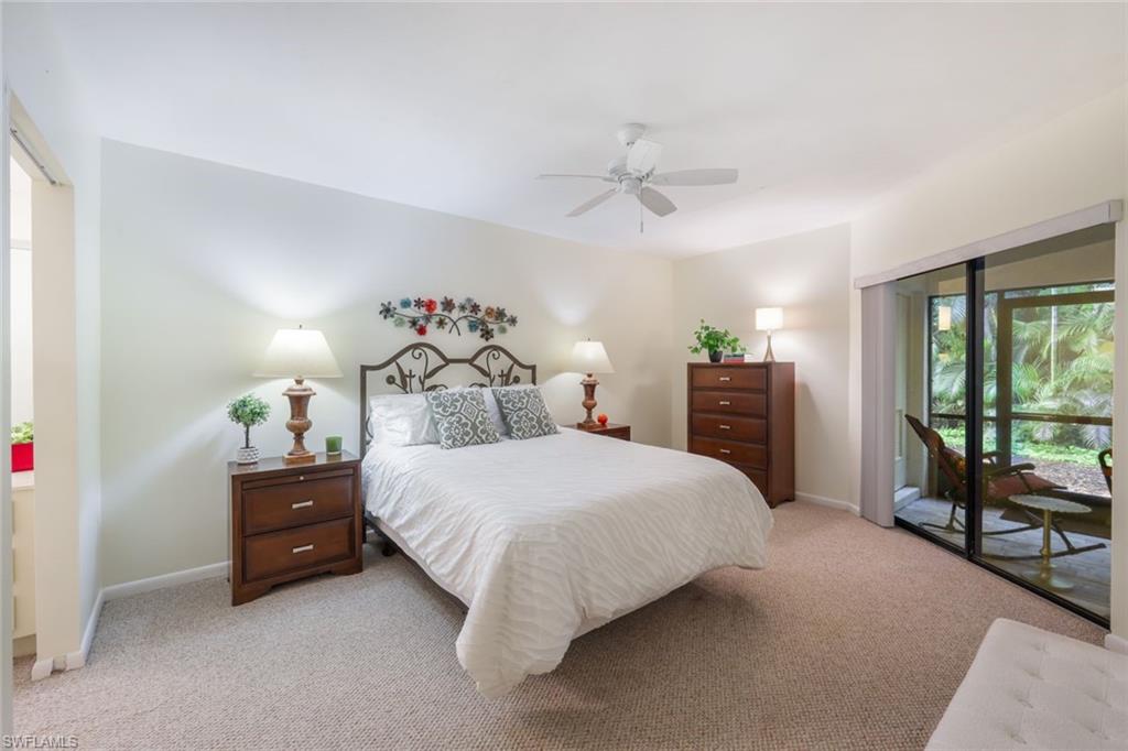 1814 Kings Lake Boulevard, Unit 102 Naples, FL 34112 - Photo 15 of 21 Spacious Primary- bedroom with entrance to back lanai