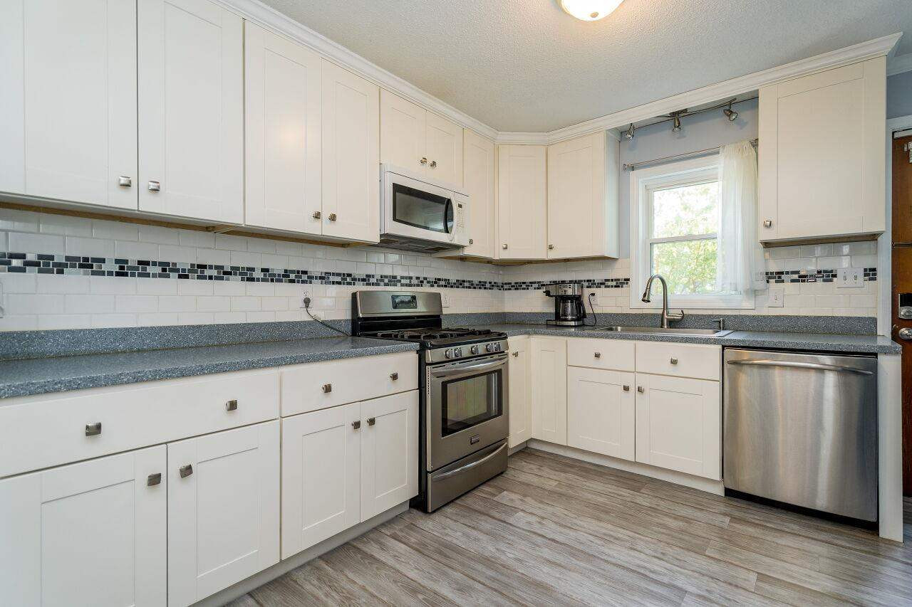The well-appointed kitchen has abundant cabinet storage. Kitchen