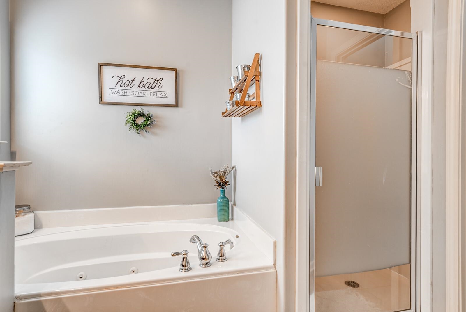 4671 Hampton Ridge Lane Bartlett, TN 38002 - Photo 26 of 40 White soaking tub with chrome fixtures and light-colored surrounding surfaces