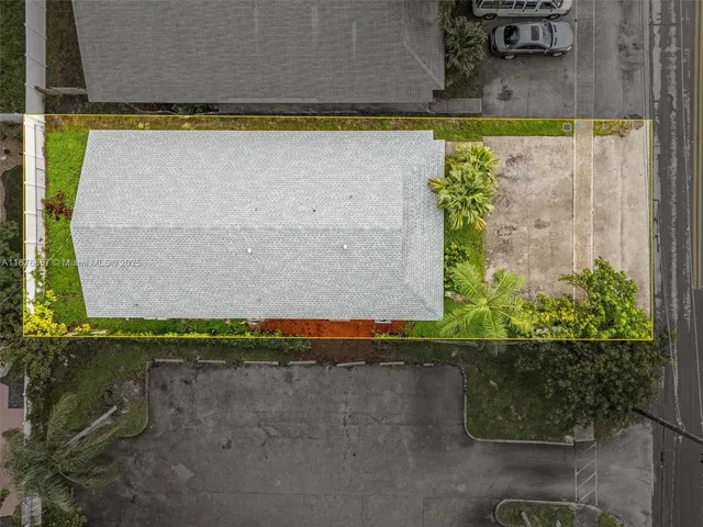 an aerial view of residential houses with city view