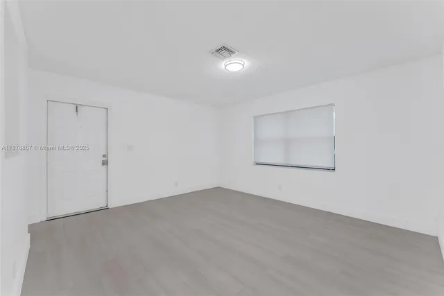 a kitchen with a sink cabinets and appliances