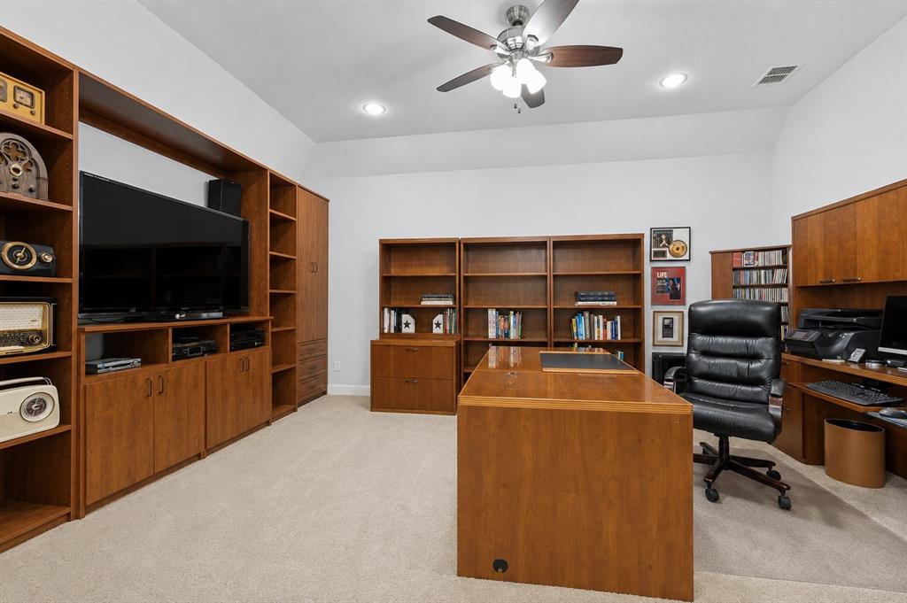 506 Life Spring Drive Rockwall, TX 75087 - Photo 19 of 36 a living room with furniture and a flat screen tv