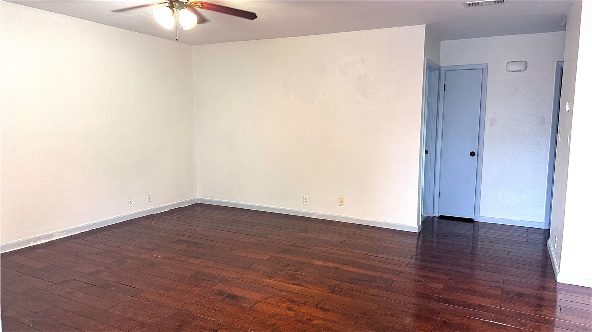 1932 Hidden Way Corpus Christi, TX 78412 - Photo 3 of 14 a view of an empty room with wooden floor