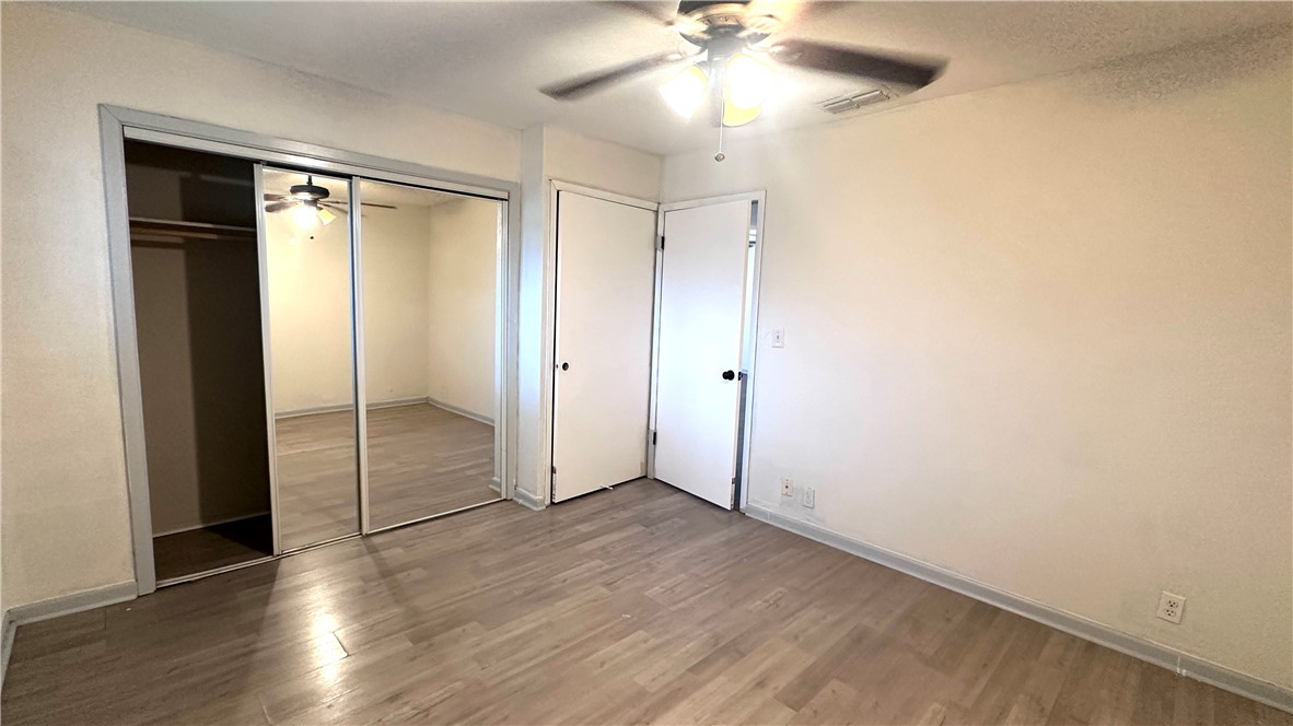 1932 Hidden Way Corpus Christi, TX 78412 - Photo 7 of 14 wooden floor in an empty room