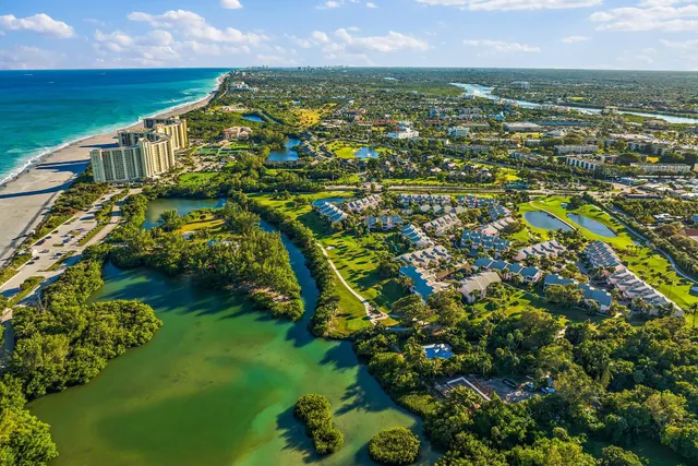 a view of a lake with a house in the background