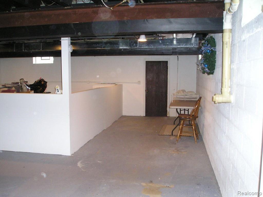 13845 Hough Road Allenton, MI 48002 - Photo 27 of 30 Basement room with vegetable & fruit storage room in the rear.