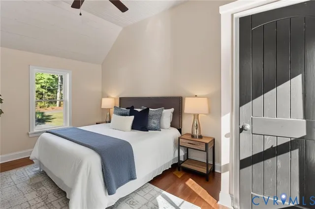 a bedroom with a bed and window