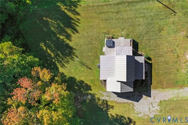 a aerial view of a house with a yard