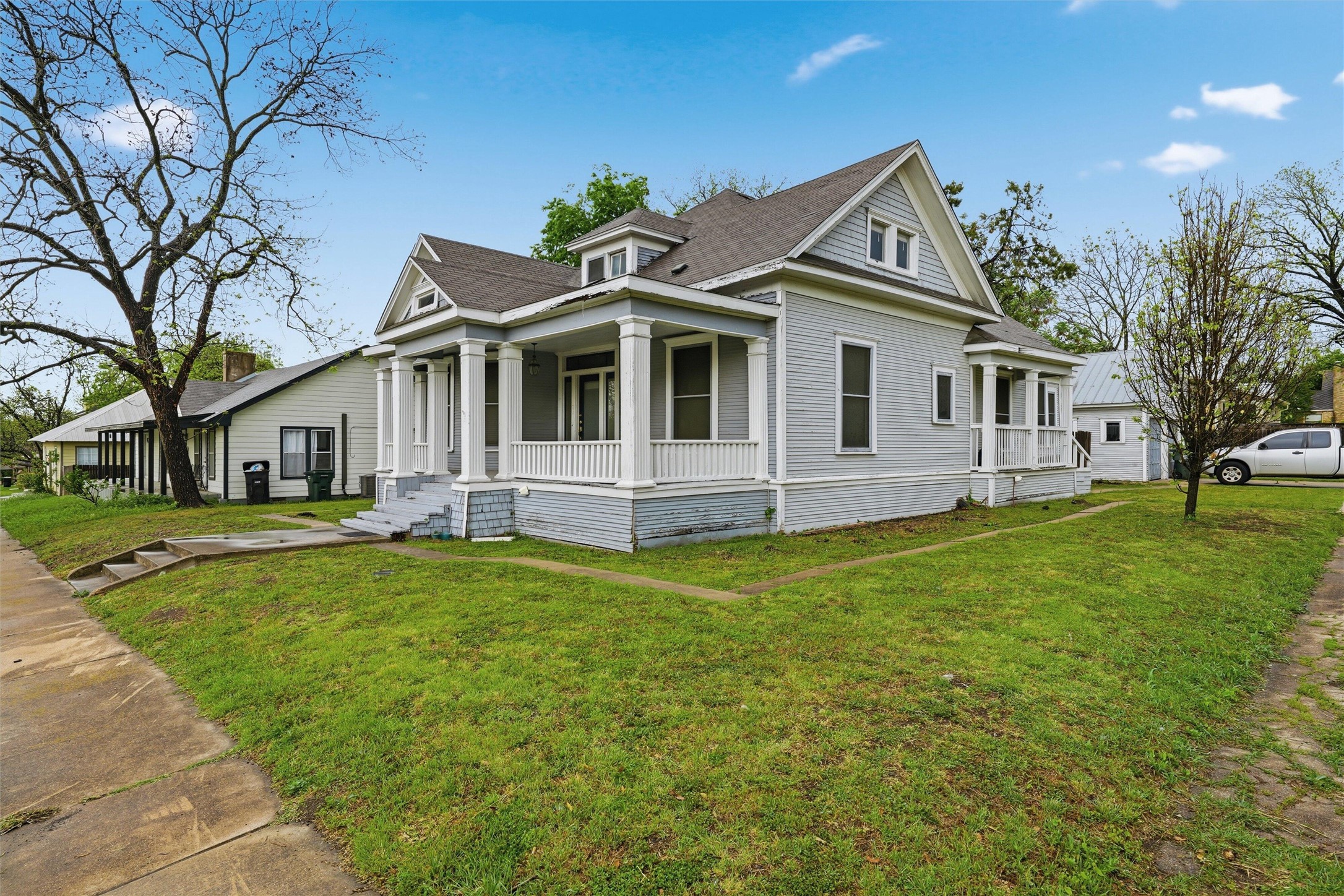 803 North 3rd Street Temple, TX 76501 - Photo 21 of 22 a front view of a house with a garden and trees