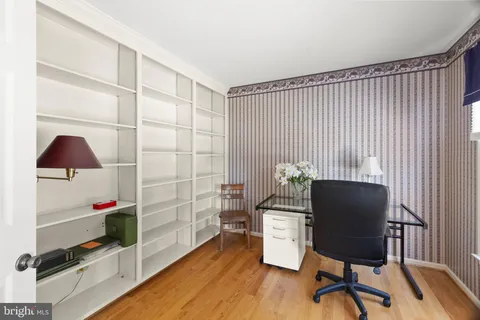 a living room with furniture fireplace and window
