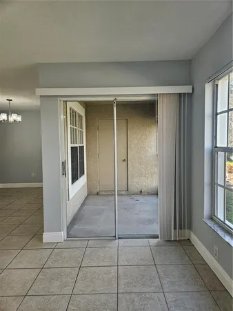 a view of a hallway with bathroom and a livingroom view