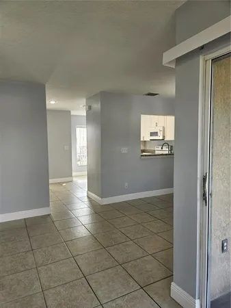 a view of an empty room and window