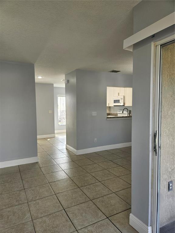 2321 Water View Loop Kissimmee, FL 34743 - Photo 15 of 41 a view of an empty room and window
