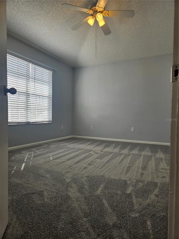 2321 Water View Loop Kissimmee, FL 34743 - Photo 20 of 41 a view of an empty room with a window