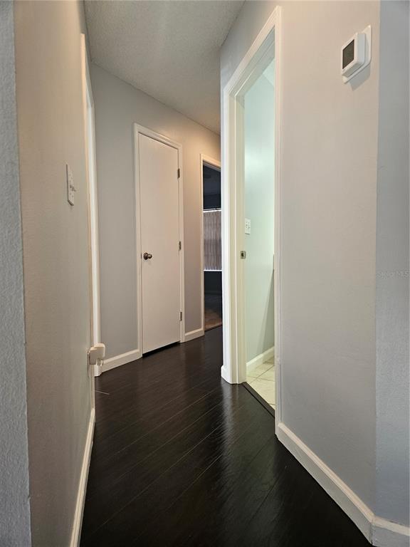 2321 Water View Loop Kissimmee, FL 34743 - Photo 24 of 41 a view of a hallway with wooden floor