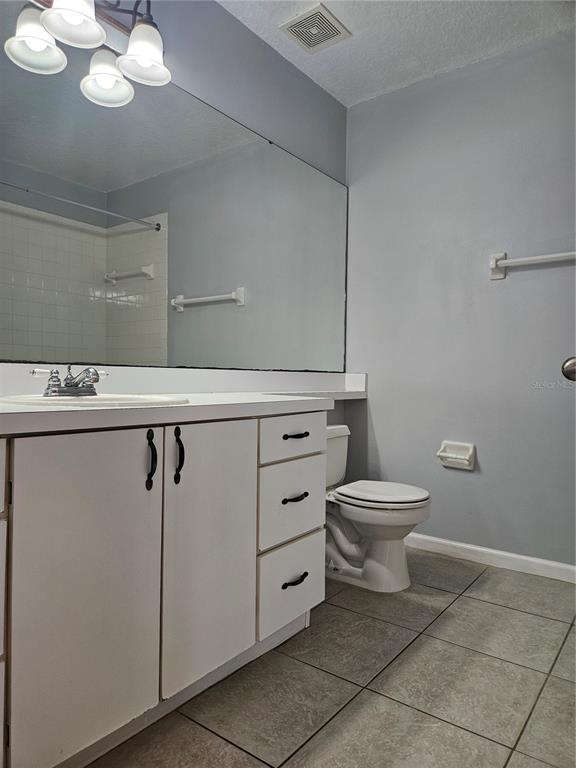 2321 Water View Loop Kissimmee, FL 34743 - Photo 25 of 41 a bathroom with a toilet sink and mirror