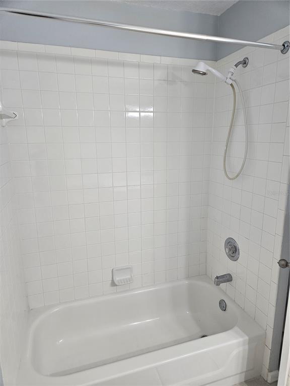 2321 Water View Loop Kissimmee, FL 34743 - Photo 26 of 41 a bathroom with a shower and a bath tub