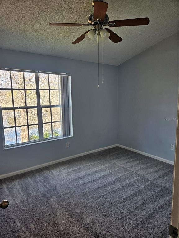 2321 Water View Loop Kissimmee, FL 34743 - Photo 29 of 41 an empty room with a window