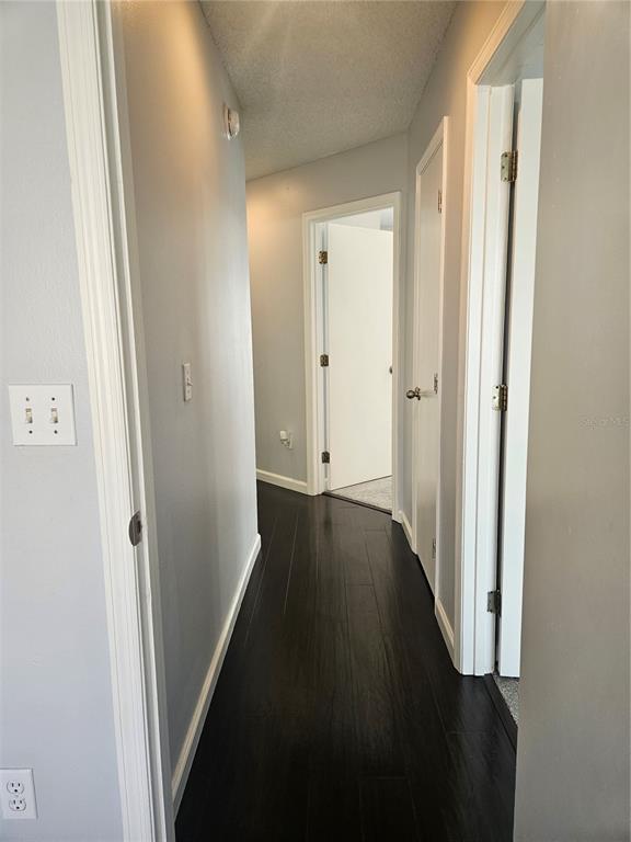 2321 Water View Loop Kissimmee, FL 34743 - Photo 32 of 41 a view of a hallway with wooden floor