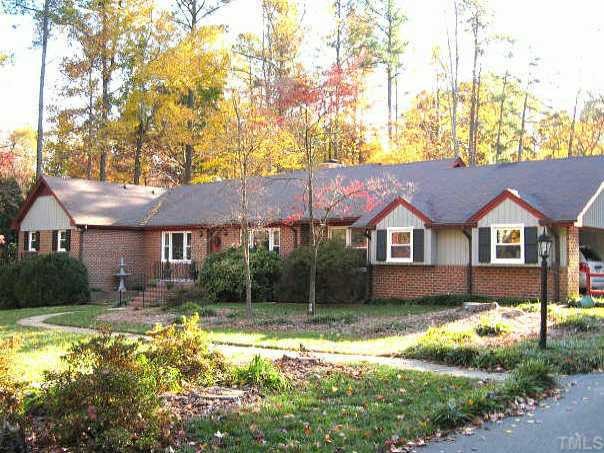 8809 Katharina Court Raleigh, NC 27613 - Photo 1 of 12 a front view of a house with garden