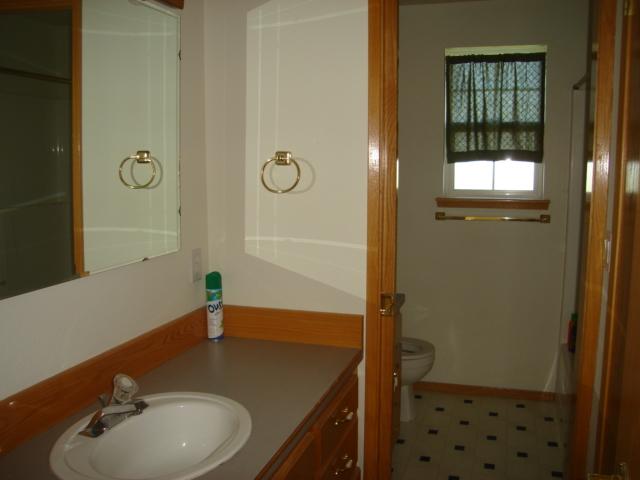 1340 Dazet Road Yakima, WA 98908 - Photo 8 of 14 a bathroom with a granite countertop sink and a mirror