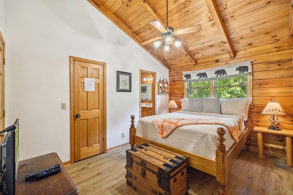 1600 My Mountain Road Morganton, GA 30560 - Photo 23 of 50 a bed sitting in a bedroom next to a window