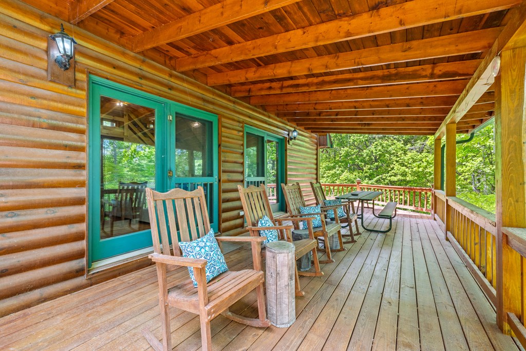 1600 My Mountain Road Morganton, GA 30560 - Photo 37 of 50 a balcony with chairs and wooden floor