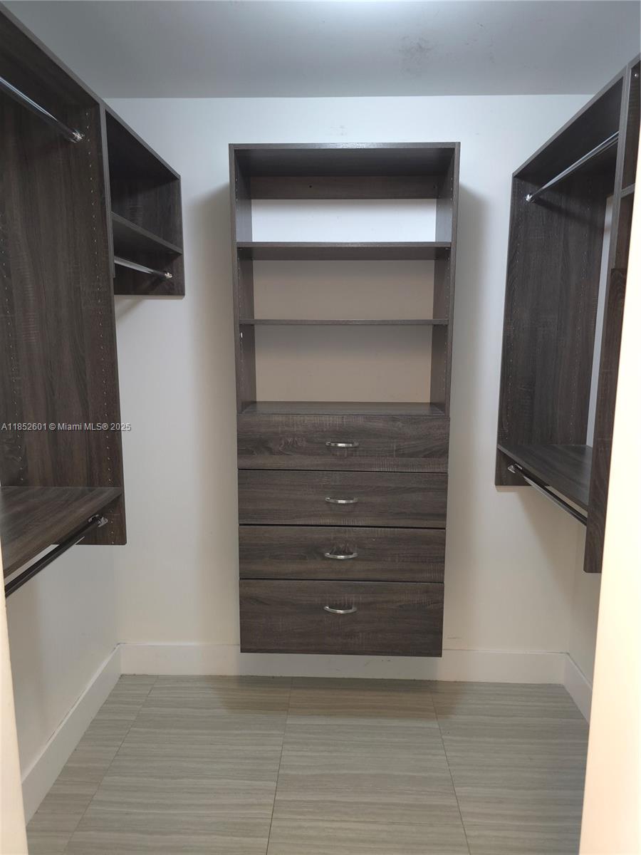 2960 Northeast 207th Street, Unit 713 Aventura, FL 33180 - Photo 17 of 33 a view of walk in closet