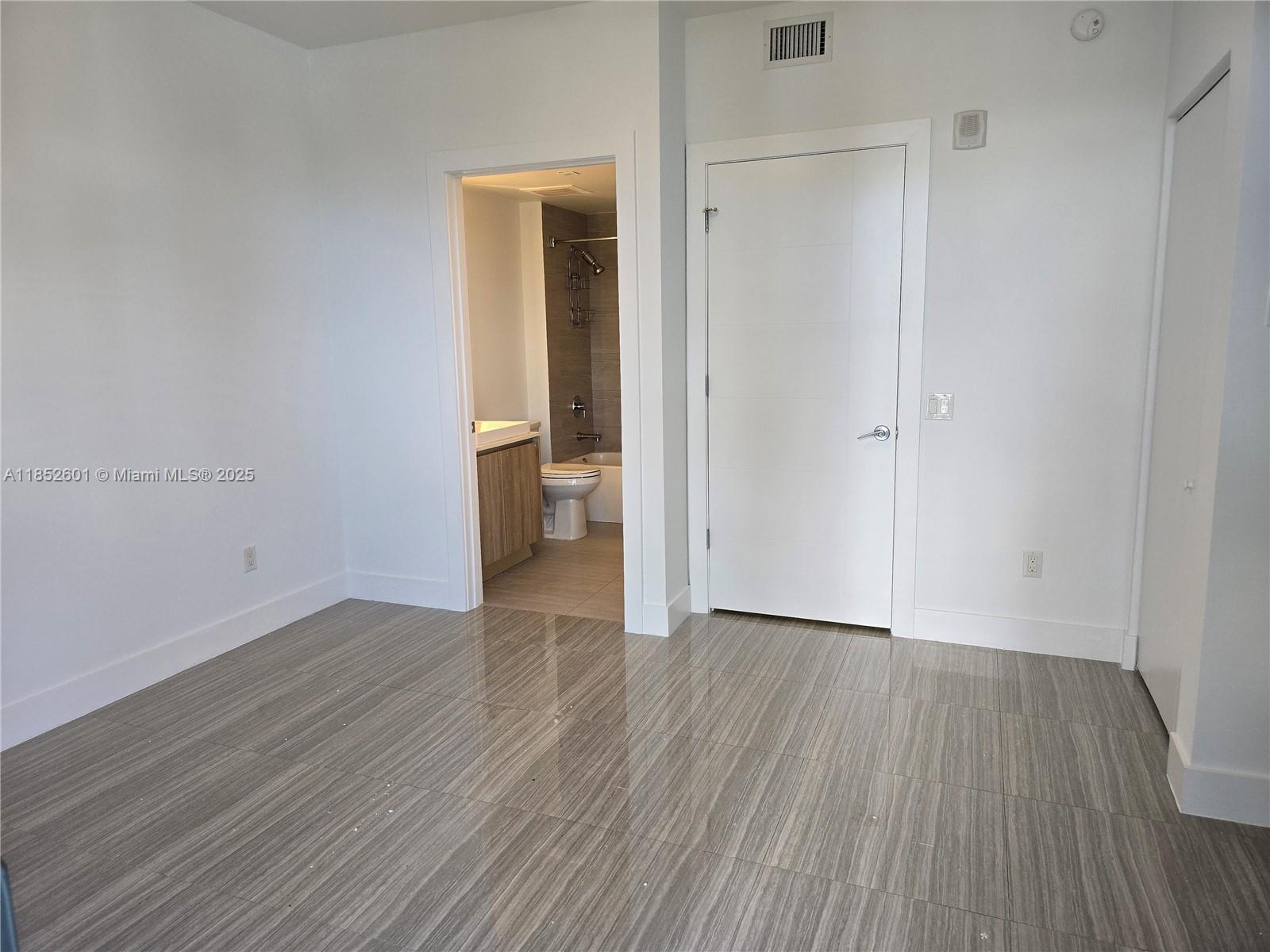 2960 Northeast 207th Street, Unit 713 Aventura, FL 33180 - Photo 22 of 33 a view of a room with wooden floor and a sink