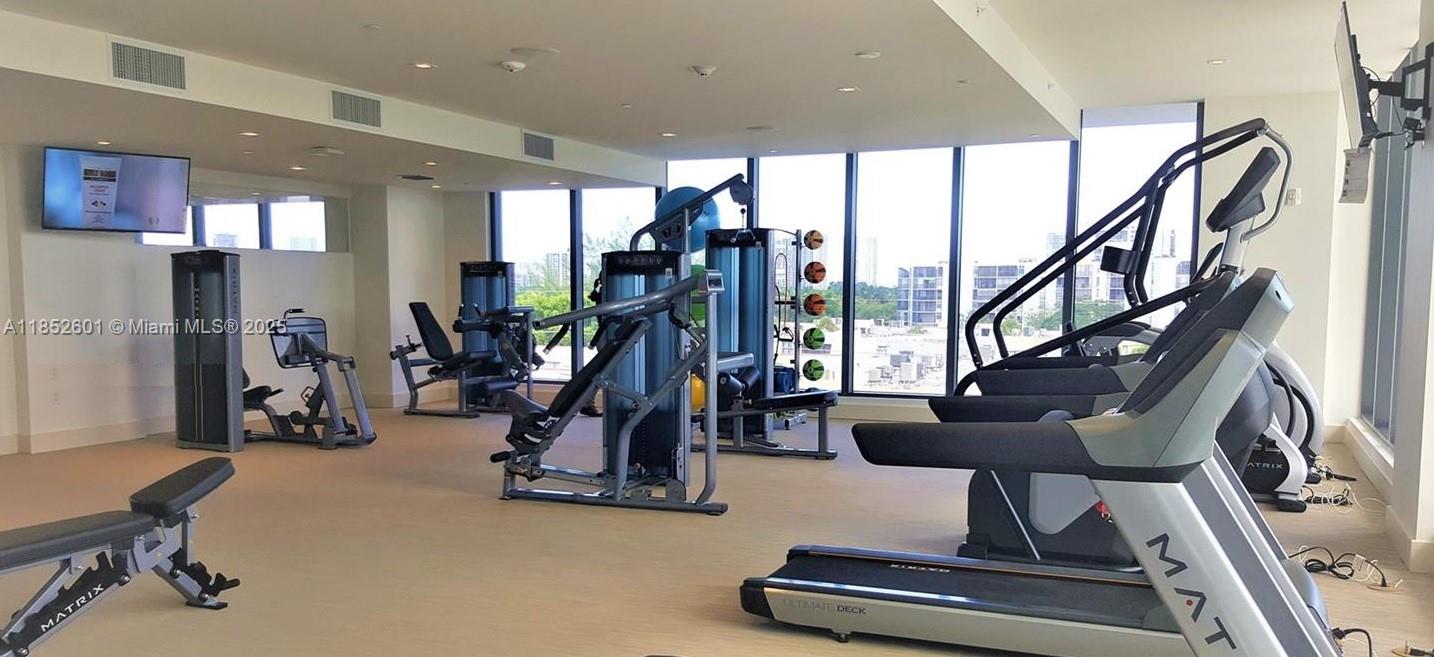 2960 Northeast 207th Street, Unit 713 Aventura, FL 33180 - Photo 30 of 33 a view of a room with gym equipment