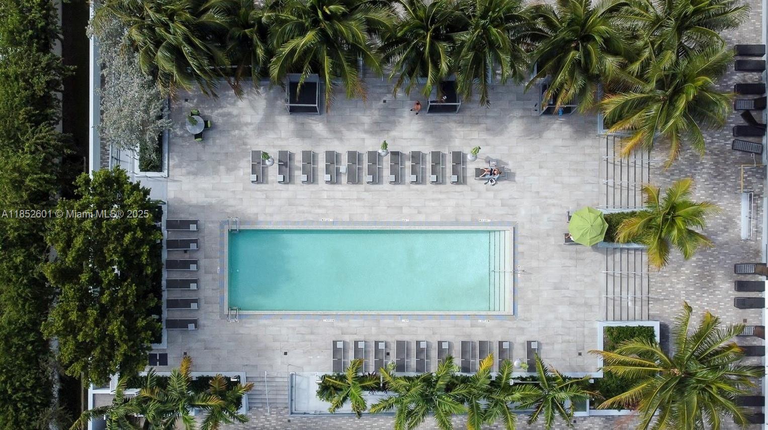 2960 Northeast 207th Street, Unit 713 Aventura, FL 33180 - Photo 31 of 33 a front view of a house with a garden