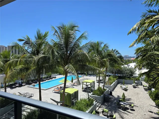 a view of swimming pool with chairs