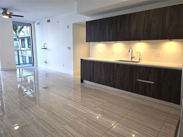 a view of kitchen with wooden floor