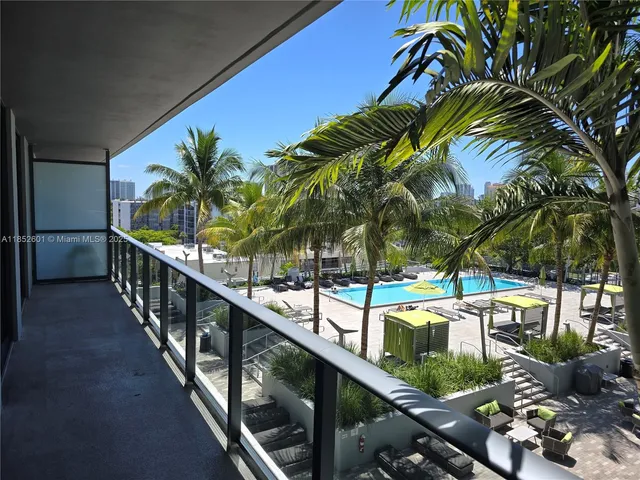 a view of swimming pool with outdoor seating