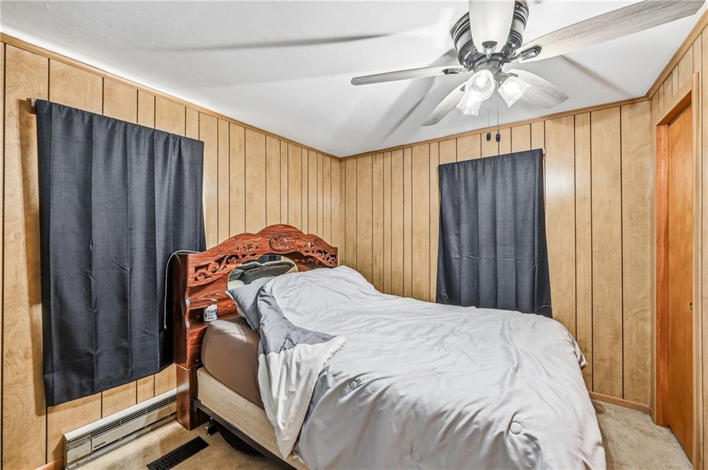 133 North Good Hope Road Greenville, PA 16125 - Photo 17 of 50 a bedroom with a bed and a chandelier