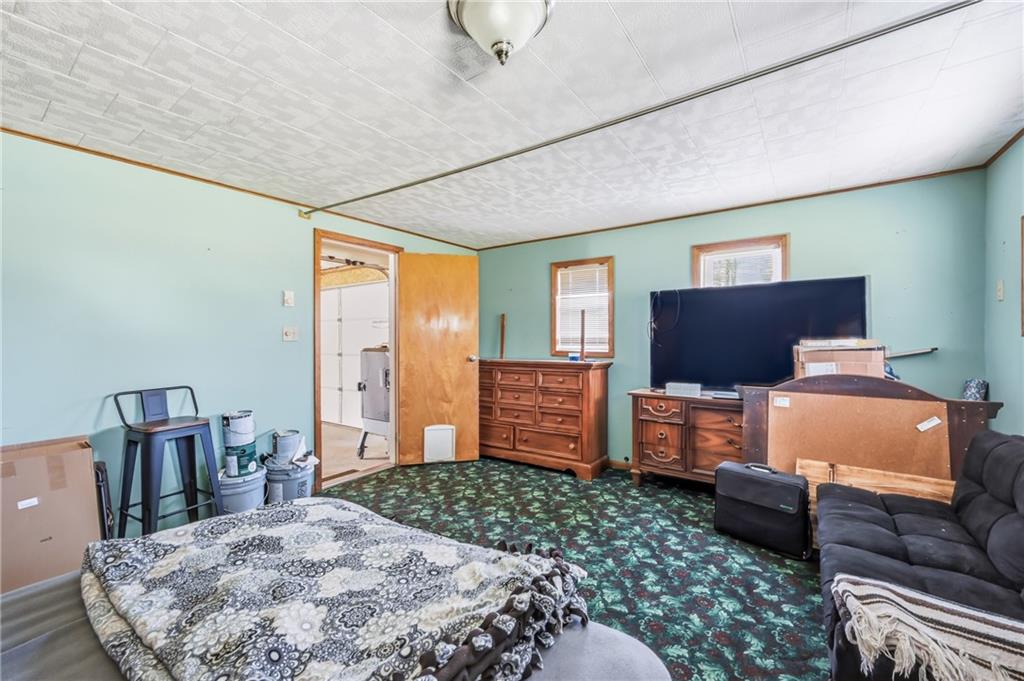 133 North Good Hope Road Greenville, PA 16125 - Photo 27 of 50 a bedroom with furniture and a flat screen tv