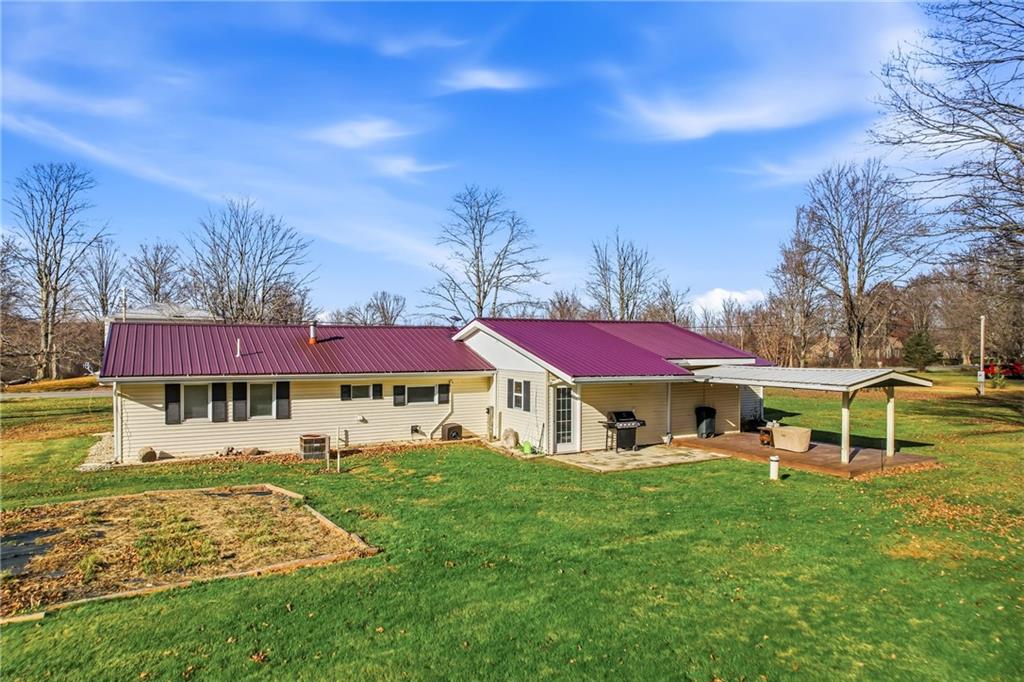 133 North Good Hope Road Greenville, PA 16125 - Photo 35 of 50 a view of a yard with a table and chairs under an umbrella