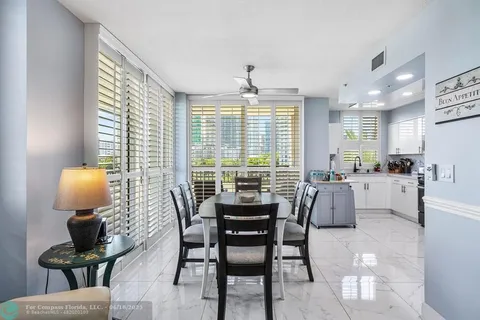 a kitchen with stainless steel appliances a refrigerator sink and microwave