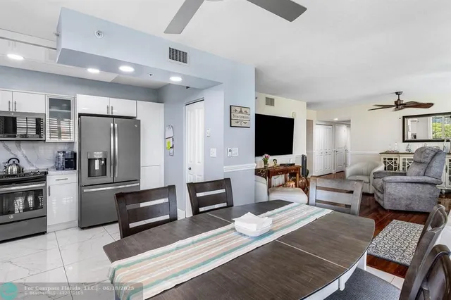 a kitchen with a stove a sink and a microwave