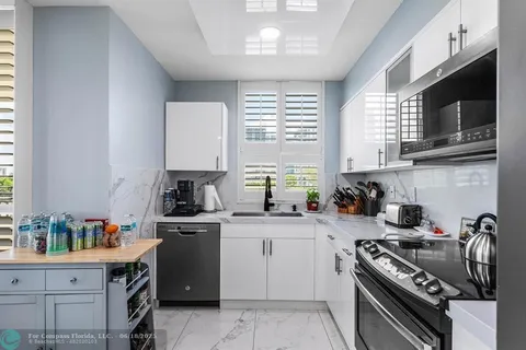 a bedroom with a bed and dresser with mirror