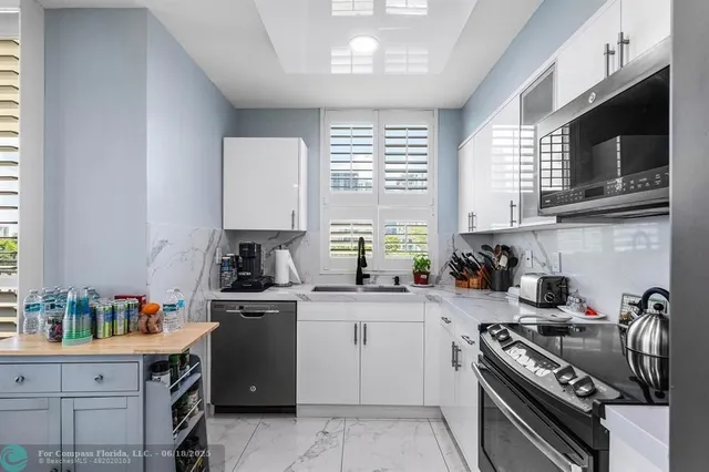 a bedroom with a bed and dresser with mirror